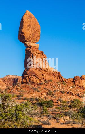 Balanced Rock formation at sunset in Arches National Park in Utah. Stock Photo