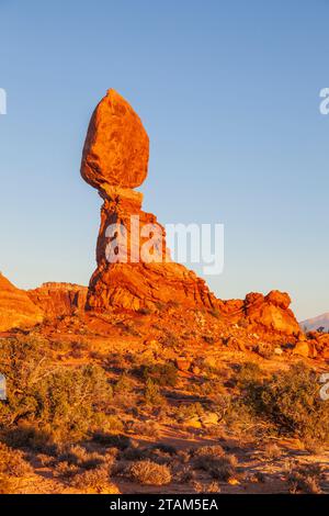 Balanced Rock formation at sunset in Arches National Park in Utah. Stock Photo