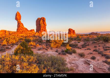 Balanced Rock formation at sunset in Arches National Park in Utah. Stock Photo