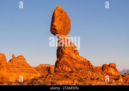 Balanced Rock Formation at sunset in Arches National Park in Utah. Stock Photo