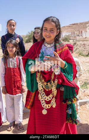 Tunisia. March 17, 2023. Girls in traditional dress in the Tunisian desert. Stock Photo