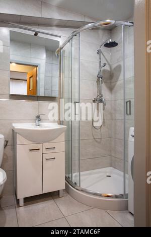 Simple cheap small bathroom in the apartment Stock Photo
