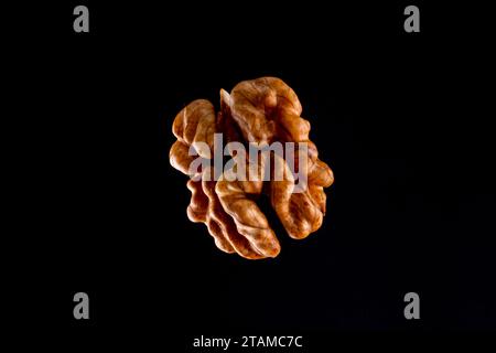 Walnuts on a black brown background. Stock Photo
