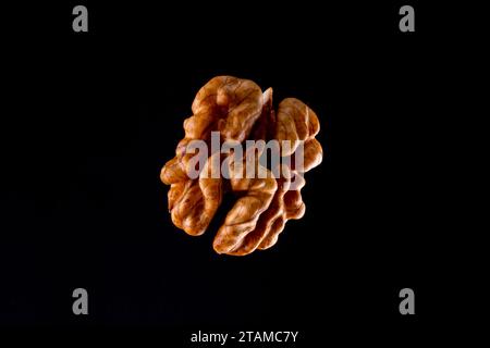 Walnuts on a black brown background. Stock Photo