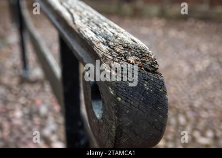 Close-up of a wooden railing in a park in the city Stock Photo