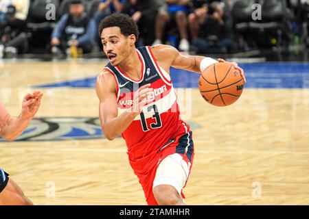 Washington Wizards guard Jordan Poole, left, shoots next to Golden ...