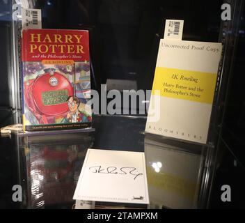New York, New York, USA. 30th Nov, 2023. (L) J.K. Rowling Harry Potter and the Philosopher's Stone one of 500 hardback first editions estimate $10,000 - $15,000 and (R) J.K. Rowling uncorrected proof Harry Potter and the Philosopher's Stone with signature estimate $12,000 -$18,000seen during the press preview for the fine books and manuscripts auction during Luxury Week at Sotheby's New York. (Credit Image: © Nancy Kaszerman/ZUMA Press Wire) EDITORIAL USAGE ONLY! Not for Commercial USAGE! Stock Photo