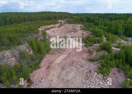 Aerial view of the old Kvartsitny quarry on a cloudy June day. Shoksha. Karelia, Russia Stock Photo