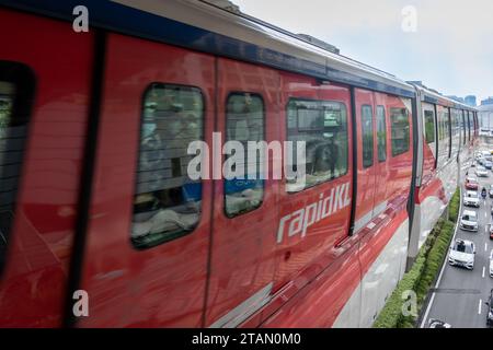 Kuala Lumpur, Malaysia - 09.12.2023: RapidKL Monorail train in motion. The KL Monorail line operated as part of the RapidKL system in Kuala Lumpur.  Stock Photo