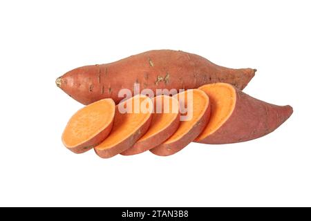Sweet potato or boniato whole and sliced tubes with red skin and yellow flesh isolated on white. Vegetable food staple. Stock Photo