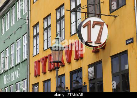 Copenhagen, Denmark - October 17, 2023: The sign at the restaurant Nyhavn 17. Stock Photo