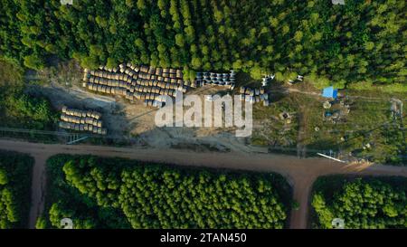 Wooden Coils of Electrical wires at outdoor construction site. High voltage cable roll. Stock Photo