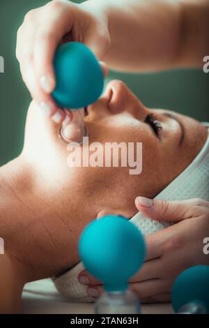 Face cupping therapy Stock Photo