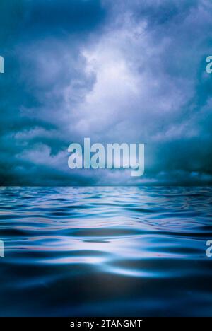 stormy cloudy sky over ocean waves Stock Photo