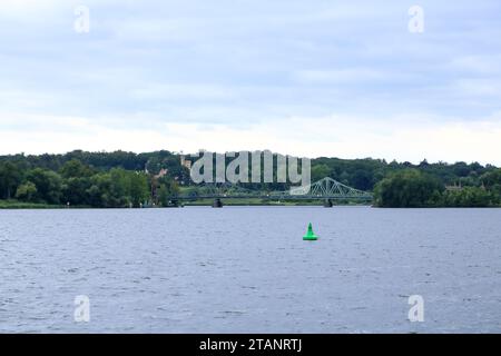July 31 2023 - Potsdam, Berlin, Brandenburg in Germany: Glienicke Bridge used to connect West Berlin and East Germany on a cloudy day Stock Photo