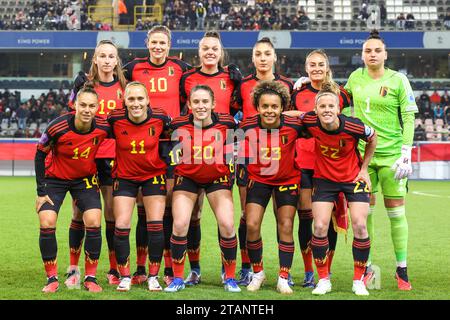 back row: Belgium's Sari Kees (19), Belgium's Justine Vanhaevermaet (10), Belgium's Tine De Caigny (6), Belgium's Amber Tysiak (4), Belgium's Tessa Wullaert (captain)(9), Belgium's goalkeeper Nicky Evrard (1) front row: Belgium's Jassina Blom (14), Belgium's Janice Cayman (11), Belgium's Marie Detruyer (20), Belgium's Kassandra Missipo (23) and Belgium's Laura Deloose (22) posing for the team photo before a match between Belgium's national women's team, called the Red Flames and Scotland's national women's team, game 5/6 in the 2023-24 UEFA Women's Nations League competition, on Friday 01 D Stock Photo