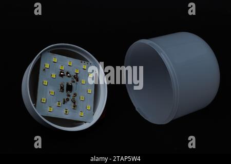 Broken white LED lamp circuits. Brocken LED light components. Stock Photo