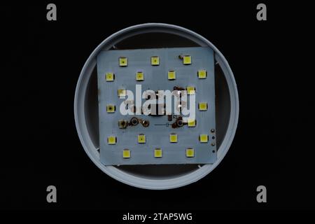 Broken white LED lamp circuits. Brocken LED light components. Stock Photo
