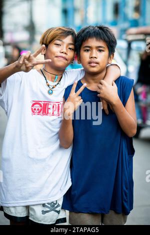 Two young boys strike a pose in Manila, The Philippines. Stock Photo