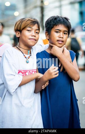 Two young boys strike a pose in Manila, The Philippines. Stock Photo