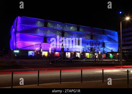 Water Mirror and Le Nuage building by night designed by Philippe Starck , Parvis Stephane Hessel, Montpellier, France Stock Photo