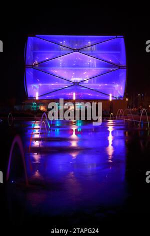 Water Mirror and Le Nuage building by night designed by Philippe Starck , Parvis Stephane Hessel, Montpellier, France Stock Photo