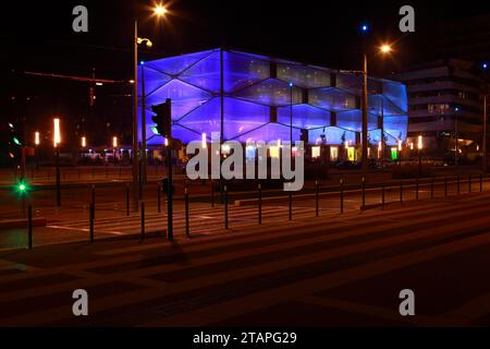 Water Mirror and Le Nuage building by night designed by Philippe Starck , Parvis Stephane Hessel, Montpellier, France Stock Photo