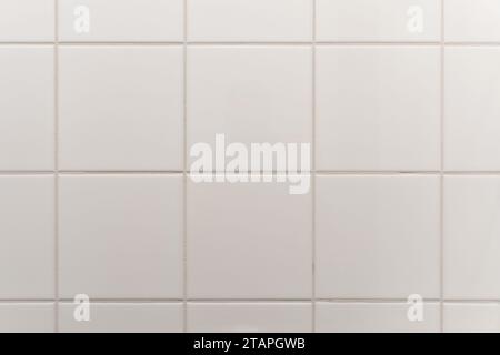 white tiled wall in the bathroom Stock Photo