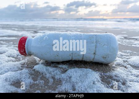 plastic waste on sandy beach Stock Photo