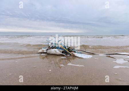plastic waste on sandy beach Stock Photo