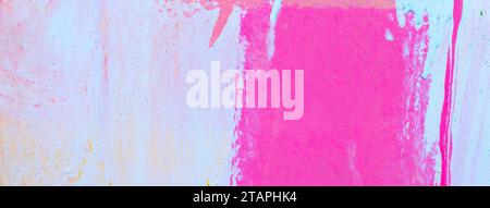 Messy paint strokes and smudges on an old painted wall. Colorful drips, flows, streaks of paint and paint sprays Stock Photo