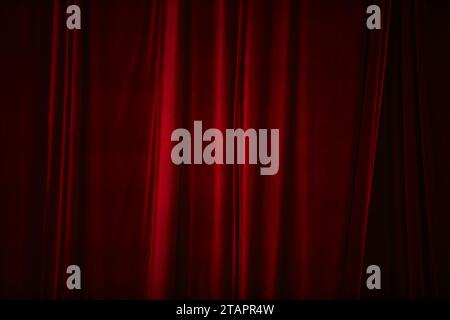 Red curtain in theatre. Textured background Stock Photo
