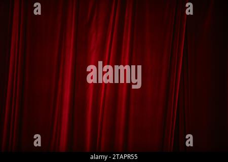 Red curtain in theatre. Textured background Stock Photo
