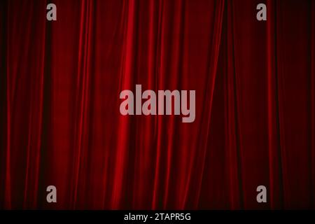 Red curtain in theatre. Textured background Stock Photo