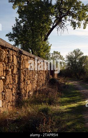 Europe, Spain, Castile and León, Sanjuanejo, Ancient Stone Wall around the Monasterio de Santa María de la Caridad Stock Photo