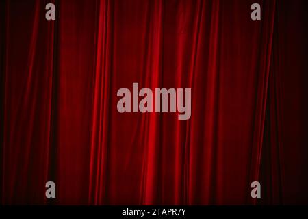 Red curtain in theatre. Textured background Stock Photo
