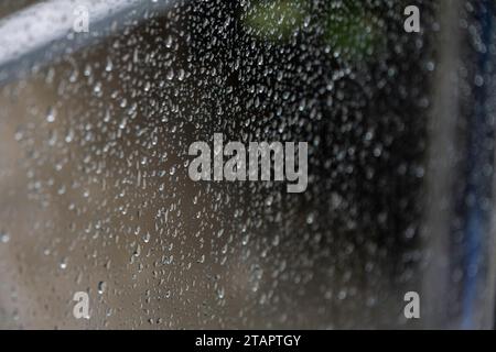 Raindrop on wet surface, close-up of condensation Stock Photo