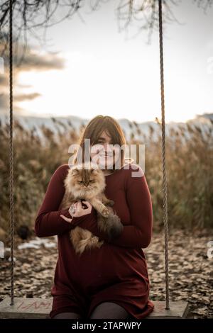 Gorgeous Setting Outside Portrait Pretty Female Brown Hair with Adorable Scottish Cat Stock Photo