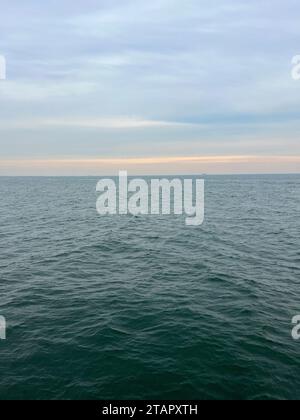 Looking out at the Atlantic Ocean from the pier at Coney Island in Brooklyn New York. Stock Photo