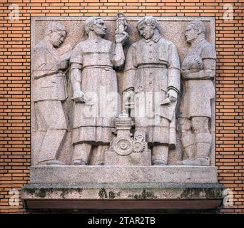 Relief of men, symbolising Liberte, Egalite, Fraternite (Equality) (Liberty) (Fraternity), on a municipal building, Paris, France Stock Photo