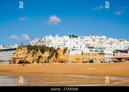 Great view of Fisherman Beach, Praia dos Pescadores, with whitewashed houses on cliff, reflecting on the sea, blue sky, summer time, Albufeira Stock Photo