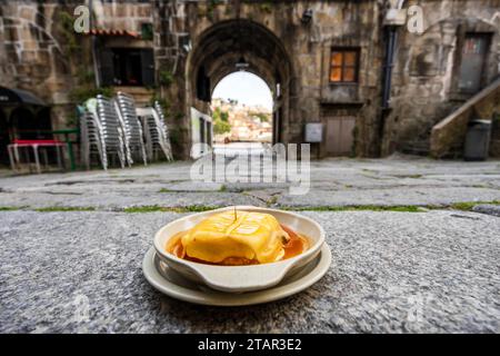 Great view of francesinha typical dish originally from Porto, made with layers of toasted bread and assorted hot meats such as roast, steak Stock Photo