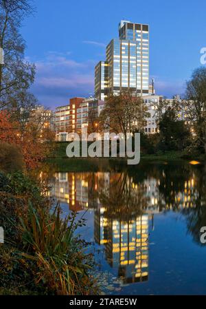 The LVA main building reflected in the Kaiserteich in autumn in the evening, Duesseldorf, North Rhine-Westphalia, Germany Stock Photo