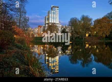 The LVA main building reflected in the Kaiserteich in autumn in the evening, Duesseldorf, North Rhine-Westphalia, Germany Stock Photo