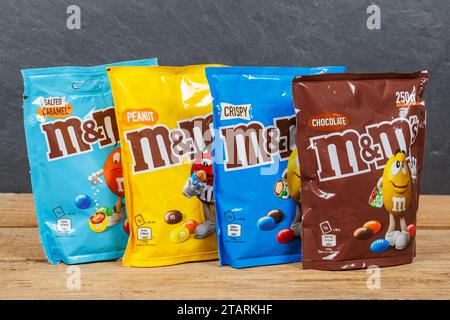 Stuttgart, Germany - May 19, 2023: Various M&M's Chocolates From Mars Inc. On Wooden Board In Stuttgart, Germany. Stock Photo