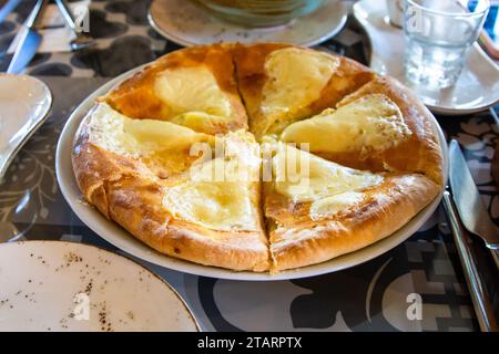 travel to Georgia - Lazian khachapuri (filled cheese pie) in local cafe in Batumi city Stock Photo