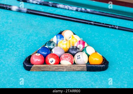 travel to Georgia - old billiard balls in wooden triangle on table on seaside boulevard in Batumi city in autumn Stock Photo