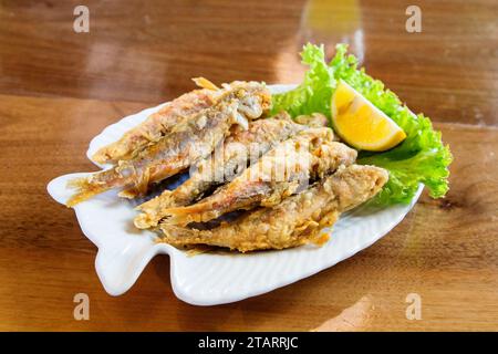 travel to Georgia - portion of fried Black Sea red mullet on plate in local cafe in Batumi city Stock Photo