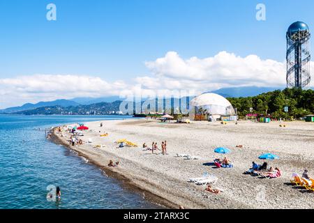 Batumi, Georgia - September 15, 2023: urban pebble beach near Alphabetic Tower in Batumi city on sunny autumn day Stock Photo