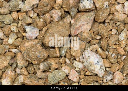 Colorful pea gravel sample river rock style, macro details directly above. Common material for lawn replacement, garden decoration and driveways. Stock Photo